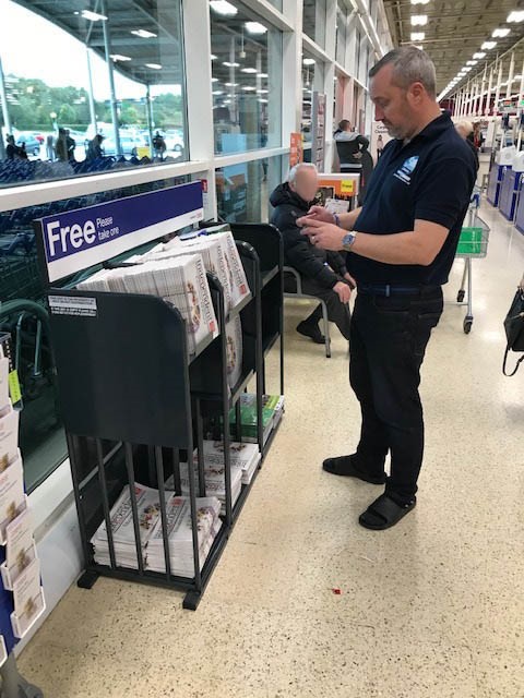 An image showing a news stand being merchandised